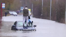 Motorist becomes stranded while trying to cross a flooded road in Yorkshire