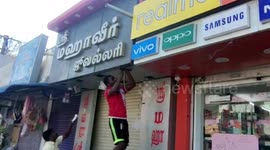 Snake rescued from inside shop sign in southern India