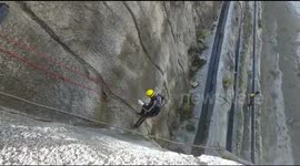 India glacier: Rescuers descend into valley by rope