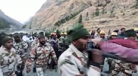 India glacier: Survivors seen being carried away by stretcher