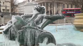 Frozen statue in Trafalgar Square as snow hits London