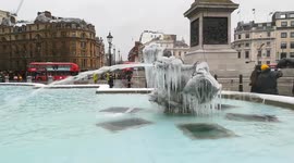 Wintery scene as London's Trafalgar Square fountain frozen