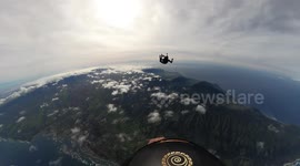 This amazing footage shows a pair of skydivers playing CATCH in freefall with a jar of honey
