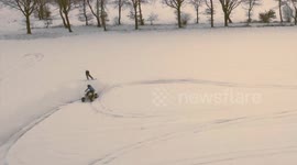 Bored Germans use ATV to pull snowboard in amazing clip