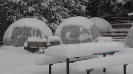Restaurants draped in dining domes appear dilapidated during desolate Ontario snow