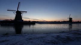 Dreamy sunset at the frozen Windmills of Kinderdijk
