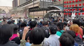 Riot police face off with protesters in Bangkok, Thailand