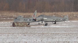 Vintage Royal Canadian air force military fighter jets spotted sitting in field near airport in Markham north of Toronto Canada