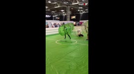 Girl Falls Down While Encased Inside a Bubble Football