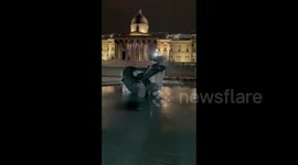 UK: Trafalgar Square Fountain Freezes Over With Coldest Weather In Decades