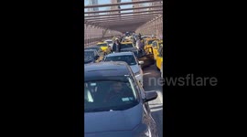 NYC taxi drivers shut down Brooklyn Bridge, demand debt relief