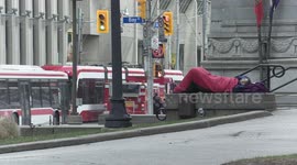 COVID 19 pandemic leaves many unemployed and the homeless population is growing in Toronto Canada, this is the scene at Queen and bay in the financial district
