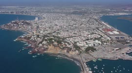 Aerial view of the Mazatlan Lighthouse in Cerro del Crestón next to the sport fishing boats in the bay in Mazatlan, Sinaloa Mexico. 2021 in Mazatlan, Mexico