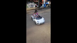 Trying new toy car happy to drive