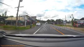 Overloaded car flips while making a turn