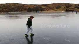 Boy runs across frozen lake!