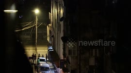 Military tank and car seen driving around the city at night during the military coup in Myanmar
