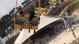 Terrifying footage as giant swing falls to ground injuring 16 at Chinese amusement park