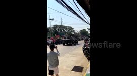 Anti-coup protesters march in Myanmar as army deploys armoured vehicles in cities