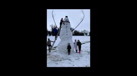 Family in Ireland build GIANT snowman with the help of a digger