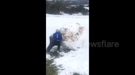 Family in Ireland build GIANT snowman with the help of a digger