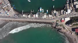 Aerial view of the maritime port, jetty and boats in the sea water in the bay on the stone island in Mazatlan, Sinaloa Mexico.