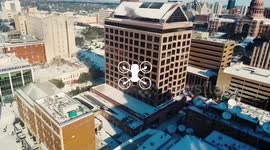 Drone footage downtown Austin Capitol covered in snow