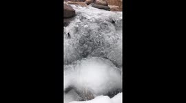 Icy outer coating forms on a beautiful rock fountain