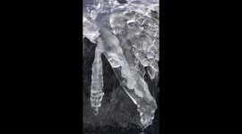 Ice formation on rock water fountain sparkles in the Colorado sunshine.