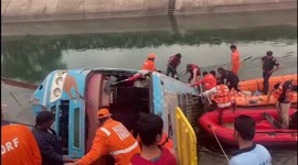 People grieve as 45 bodies pulled from the water in India bus crash
