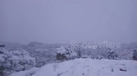 Picturesque snowfall blankets the famous Acropolis of Athens