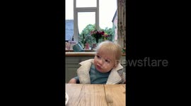 Laughing UK baby boy taste tests variety of new food