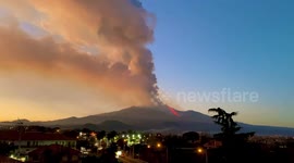 Sicily residents watch on as an erupting Mount Etna sends ash clouds into air