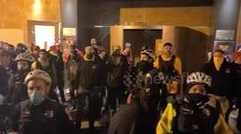 Proud boys light fireworks and throw them at counter demonstrators.