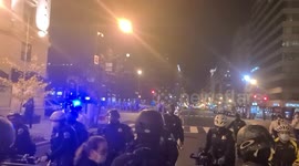 Counter demonstrators clash with Police outside hotel