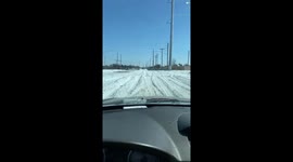 Thick snow covers streets in Dallas Monday morning