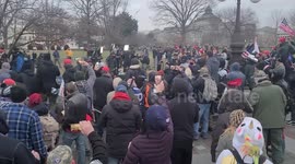 Crowd after being inside the United States Capitol smashes Media Cameras