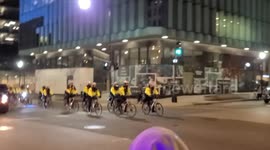 Metropolitan Police ride through black lives matter plaza.