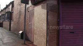 Banksy hula-hooping girl mural removed from wall in UK after gallery purchases piece