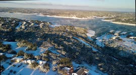 Drone footage: millions without power as winter weather blasts the US