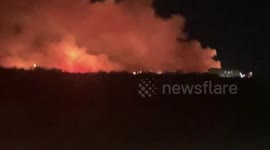 Grass fire burns through 10 acres in Las Vegas