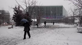 Snow falls in Lower Manhattan as winter storms continue