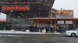 People lined up waiting to buy food in Texas winter weather
