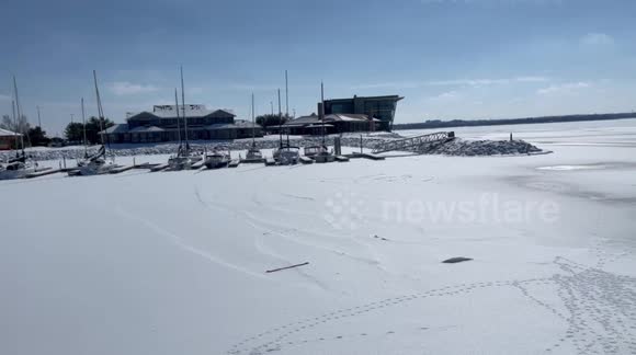 Lakes of Oklahoma City frozen over by cold storm blasting USA