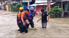 Residents of flooded neighbourhoods evacuated after heavy rains in Jakarta