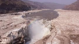 Waterfall on China's Yellow River back flowing as ice slowly thaws