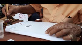 Famous Calligraphy Writter In Egypt Shows People His Work