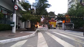 The policeman take a motorcycle from the place there is a fire.