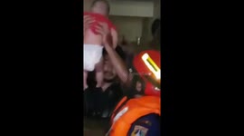 Baby evacuated from flooded home in Indonesian capital