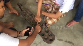 Playing Congkak